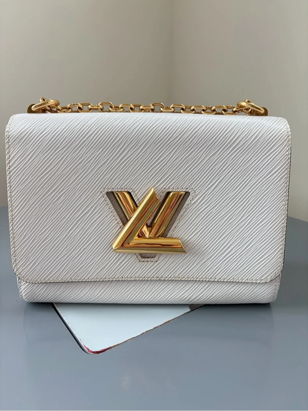 Louis Vuitton White Crossbody Bag with Gold Chain and LV Logo